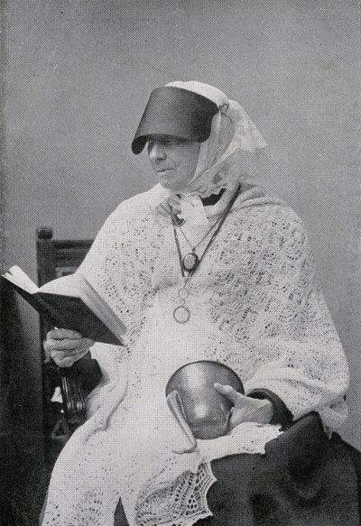Jane Whyte Balfour, aunt of Robert Louis Stevenson, reading and holding an ear trumpet by British Photographer
